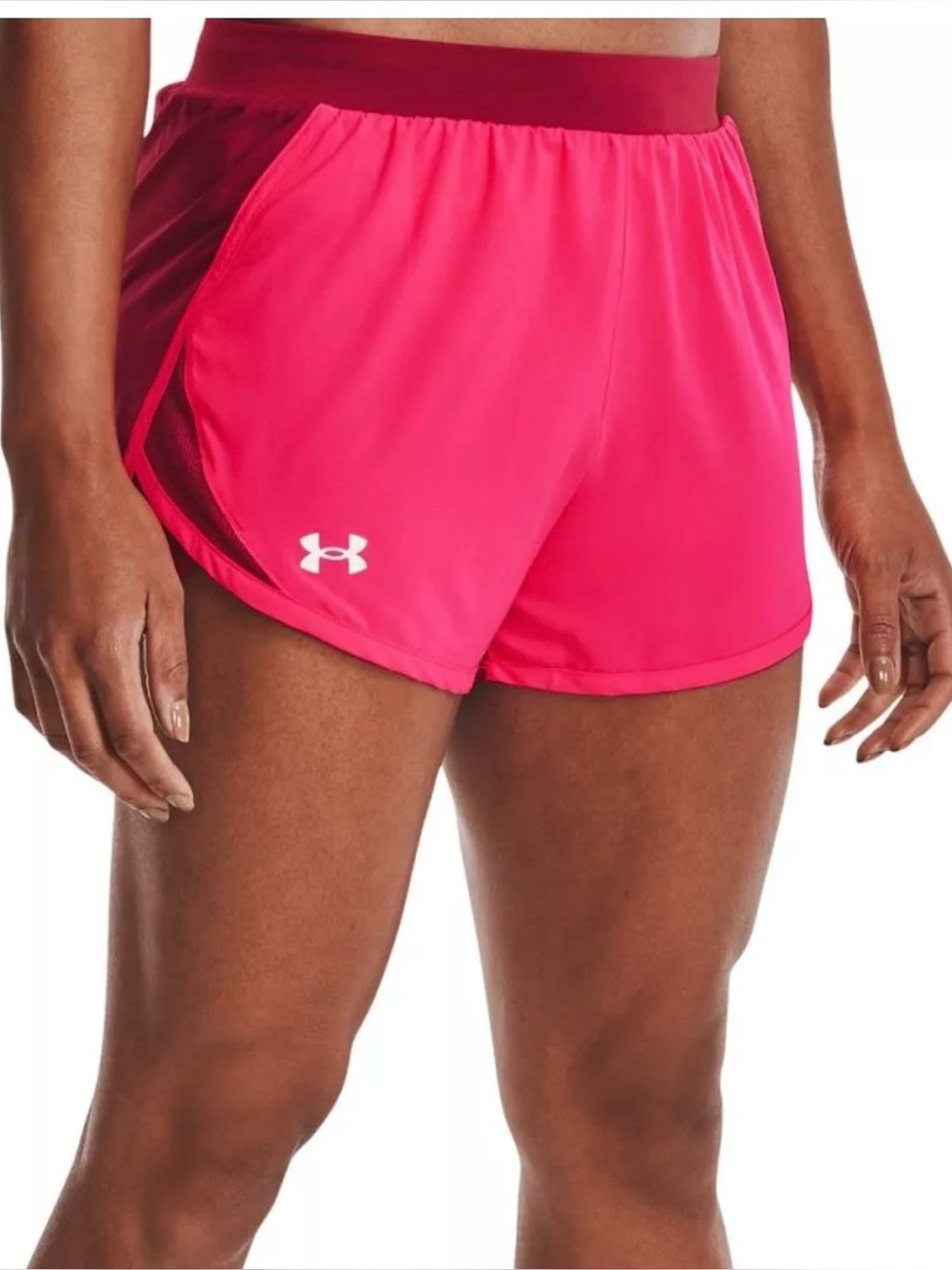 Under Armour Women's Fly By 2.0 Shorts in pink and burgundy